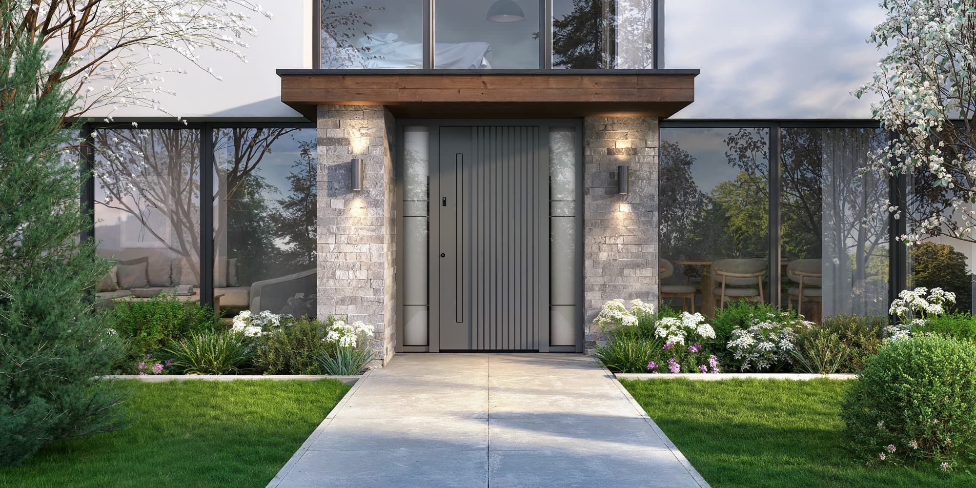 Moderne dunkle Inotherm Aluminium-Haustür zwischen Naturstein und Garten
